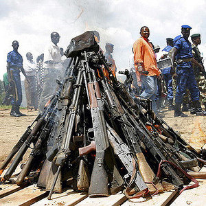 Weapons being burnt during the official launch of the Disarmament, Demobilization, Rehabilitation and Reintegration (DDRR) process in Muramvya, Burundi. Burundian military signed up voluntarily to be disarmed under the auspices of United Nations peacekeepers and observers. 2/Dec/2004. Muramvya, Burundi. UN Photo/Martine Perret. www.un.org/av/photo/